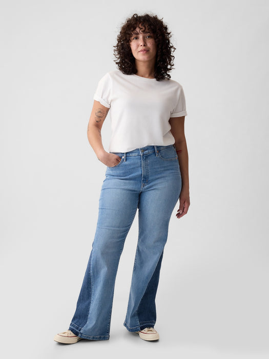 High Rise Patched '70er Schlagjeans