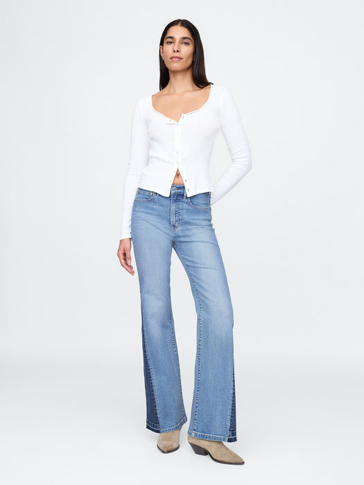 High Rise Patched '70er Schlagjeans