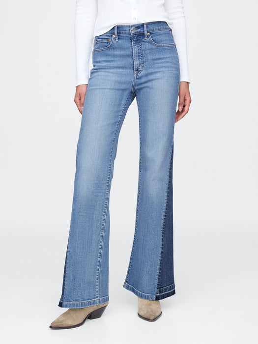 High Rise Patched '70er Schlagjeans
